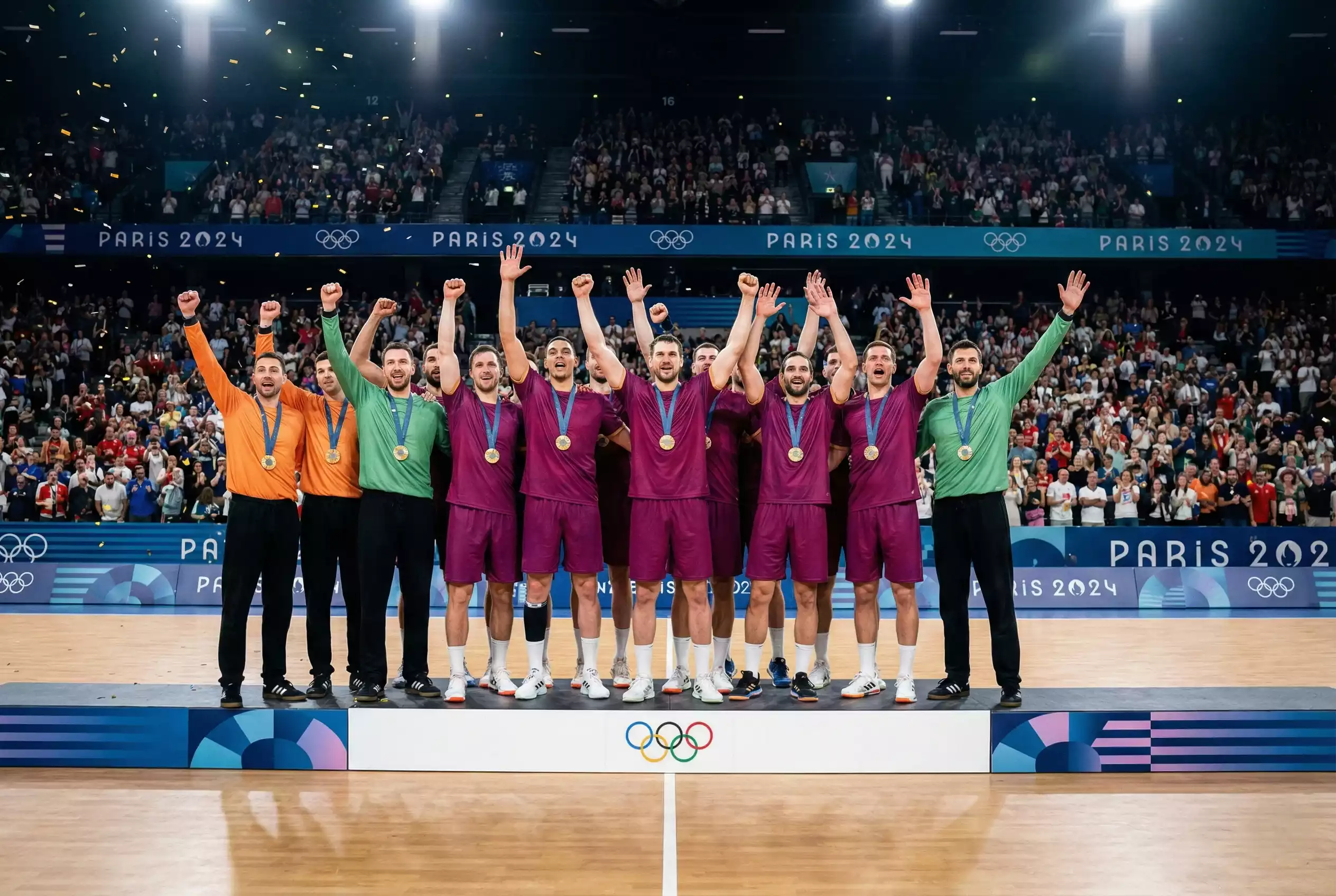 Équipe de handball célébrant une victoire sur le podium olympique avec des médailles